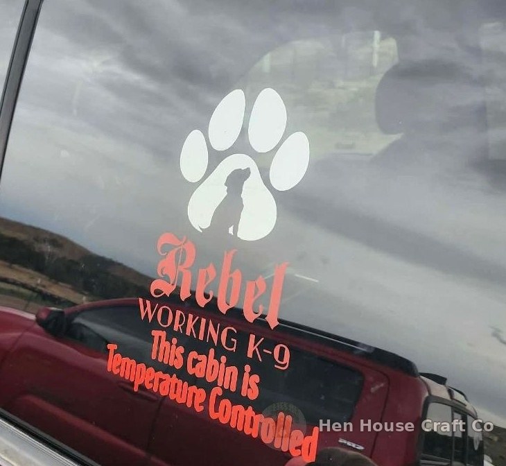 Custom Rebel Working K-9 vinyl decal on a truck window